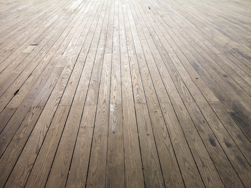Aged wooden floor planks showing natural texture and grain after restoration